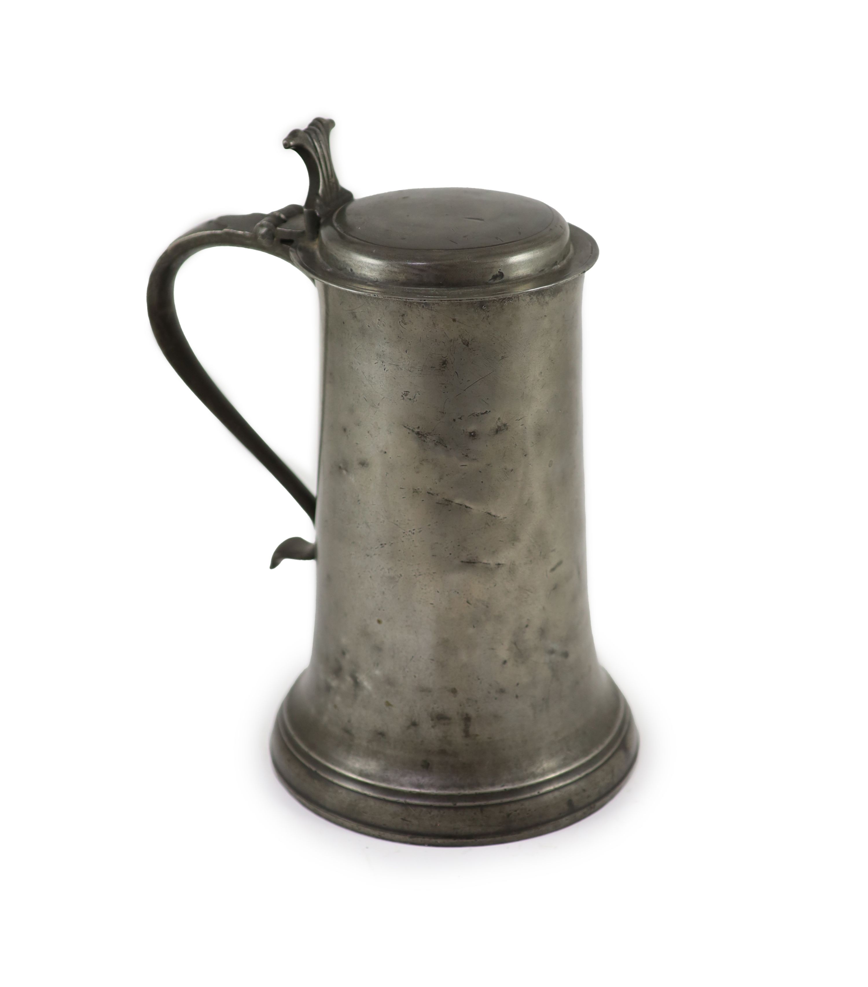 An early 17th century pewter flagon of large proportions H 34cm.